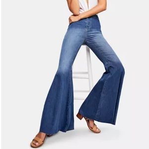 Bebe denim asymmetrical ruffle flare jeans size 27